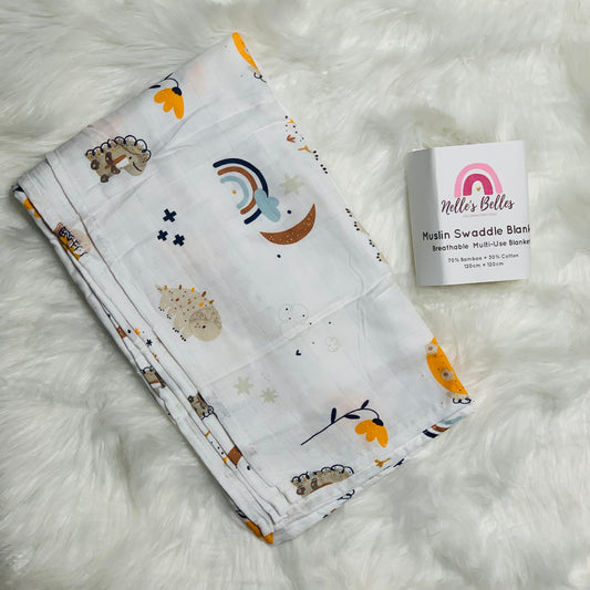 Dinosaurs, Rainbows and moons Muslin blanket